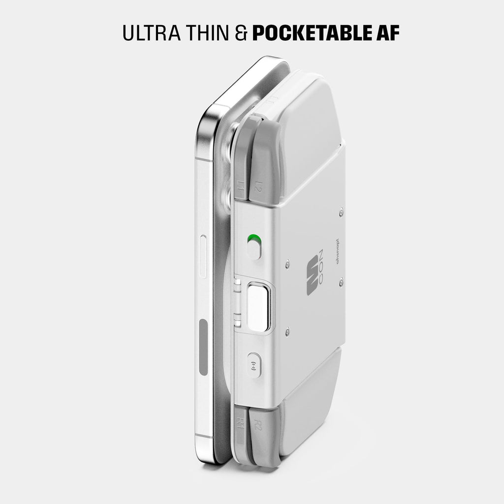 Compact, ultra-thin device with a sleek design, featuring buttons and a green indicator light.